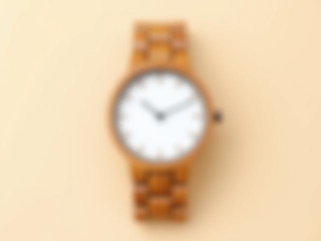 Germaine J Thomas Bamboo Solstice minimalist wooden watch with light bamboo links and a clean white dial.