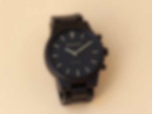 Germaine J Thomas Ebony Sleek minimalist watch featuring dark ebony wood and a striking, clean dark dial.