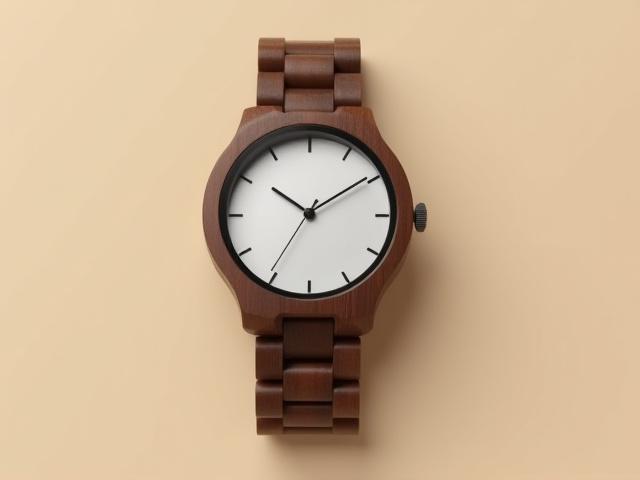 Germaine J Thomas Walnut Flow minimalist wood watch, featuring rich dark walnut and an elegant, unadorned silver dial.